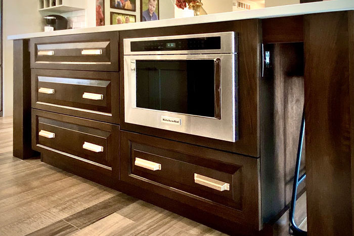 dark-wood-kitchen-island-stainless-steel-appliances-image-the-design-studio-breese
