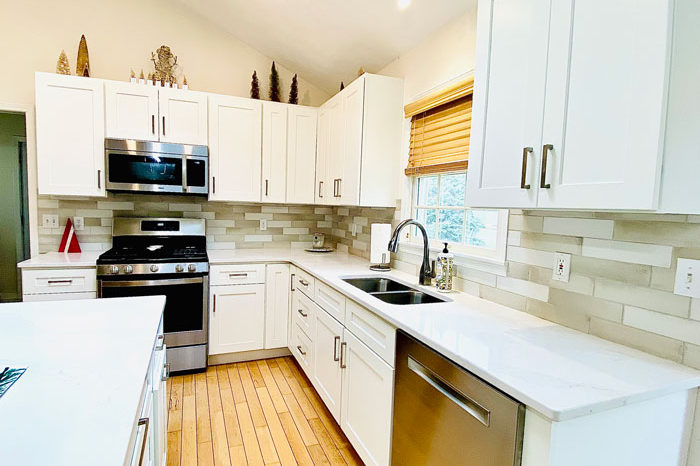 the-design-studio-breese-kitchen-white-cabinets-with-backsplash-image